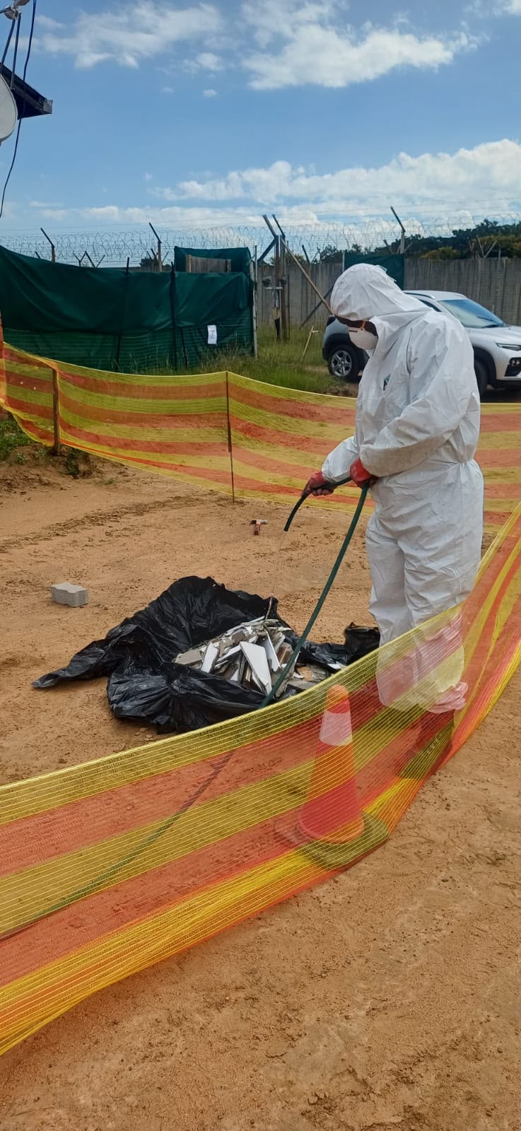 White suit containment zone worker